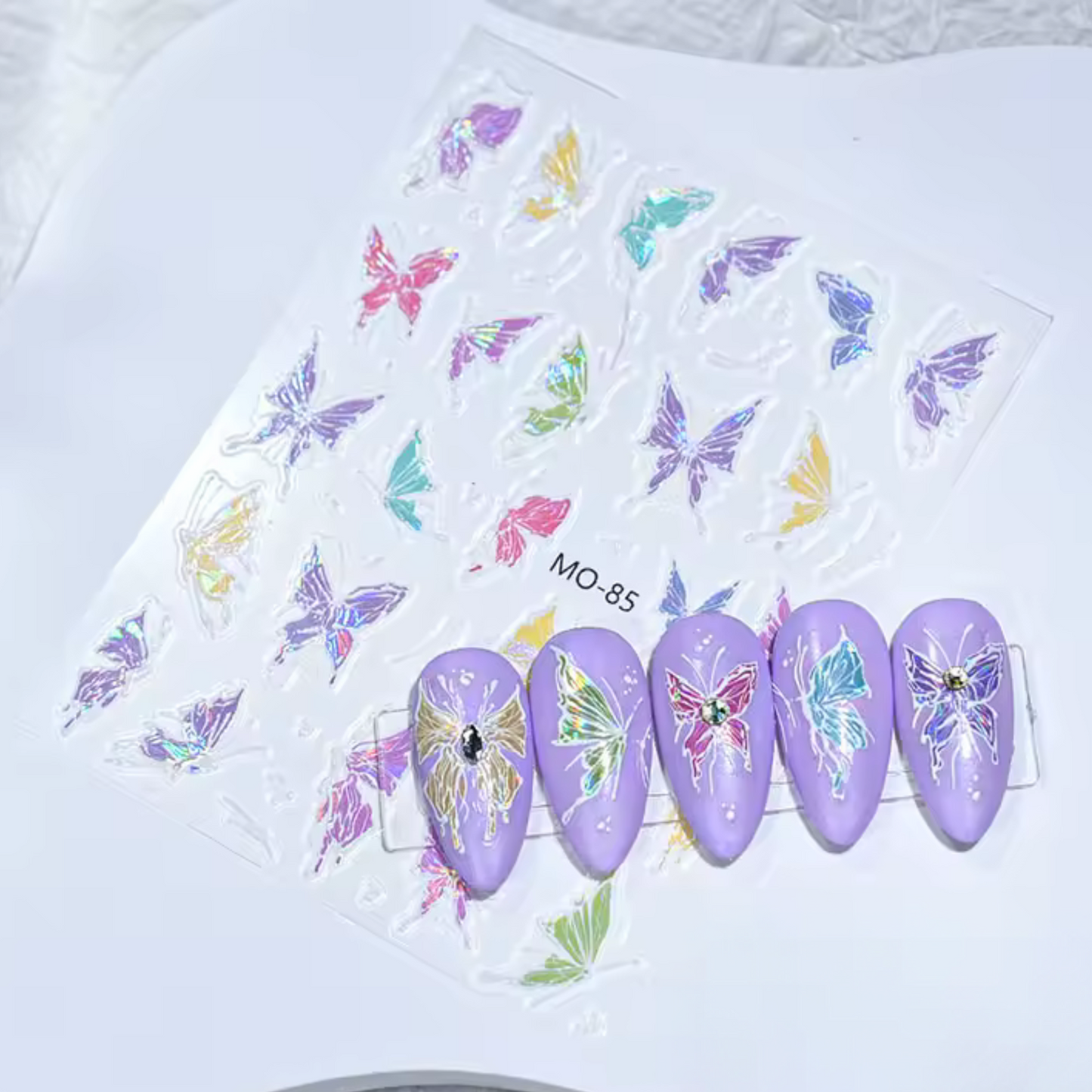 Nail art stickers with colorful butterfly designs on a white background