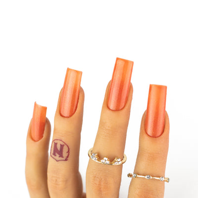 hands wearing OG164 Dark Orange Trio by Notpolish