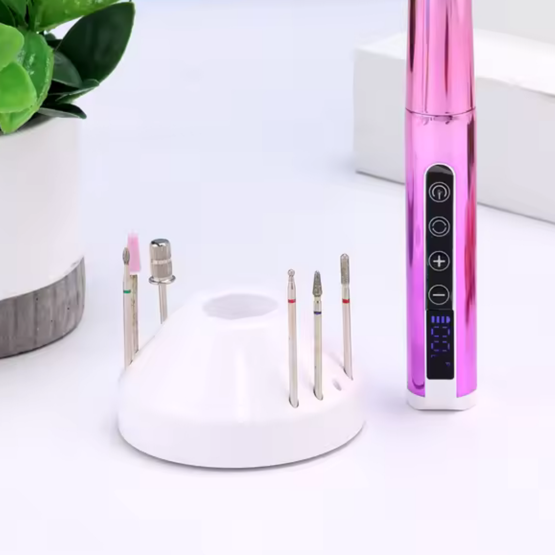 nail drill bits on white stand