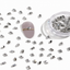 Mixed-shape clear nail crystals with silver frames for luxury nail art and professional manicures.