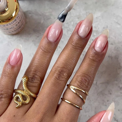 DND DC Dap Dip Powder 1.6oz - 2450 Sheer Glow hand