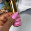finger wearing DND DC Gel - 131 White Magenta