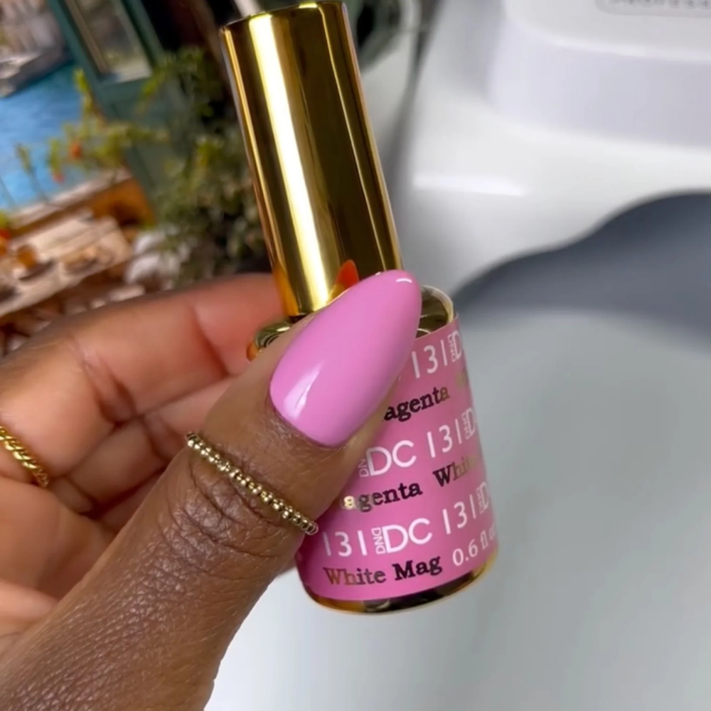 finger wearing DND DC Gel - 131 White Magenta