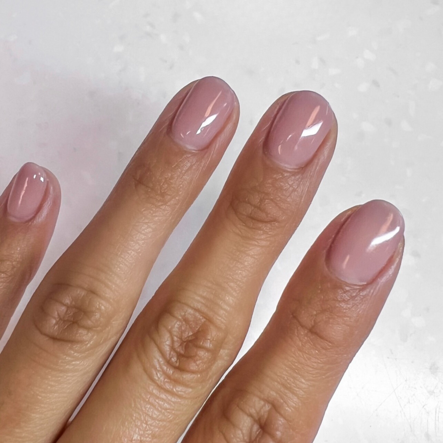 hands wearing DND Gel ‘Sheer In The City’