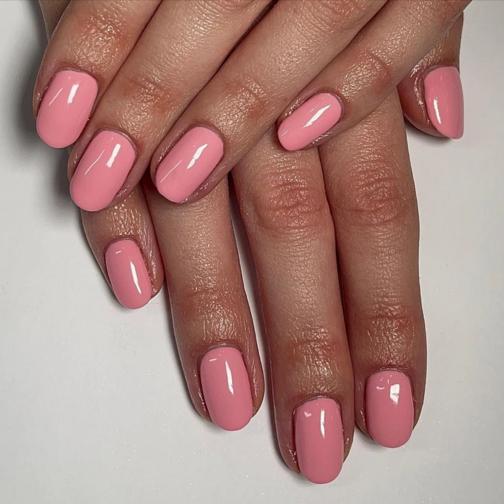 hands wearing DND Gel Polish - 555 Peach Fuzz