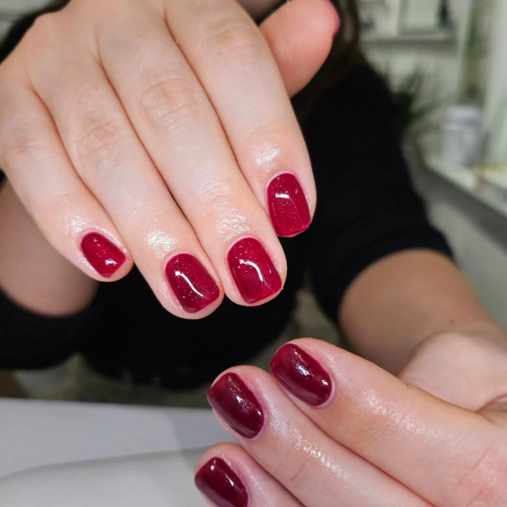 hands wearing DND Gel and Polish duo 701 Wanna Wine