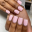 hands wearing DND Gel Polish 550 Coral Castle, FL