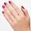 Hands wearing Q10 Blame The Mistletoe Polish by OPI