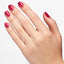 Hands wearing Q24 Blame The Mistletoe Infinite Shine by OPI