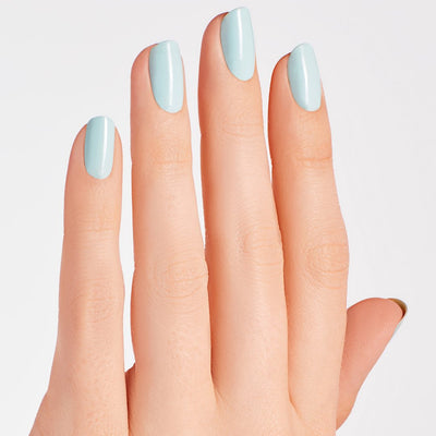 hands wearing M83 Mexico City Move-mint Intelli-Gel by OPI