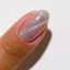 finger wearing DND DC 9D Cat Eye Gel 'Opal Elixir'