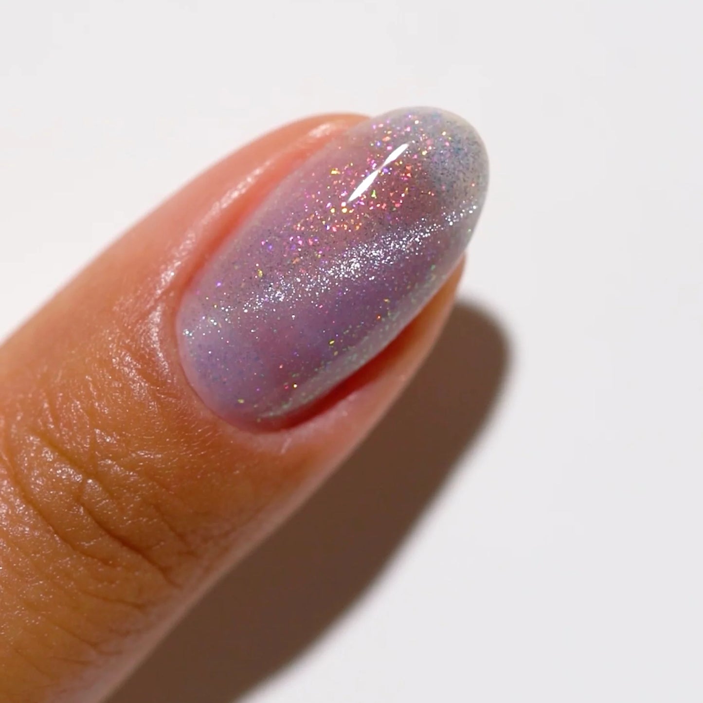 finger wearing DND DC Cat Eye Celestial Prism