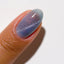 finger wearing DND DC Cat Eye Seascape