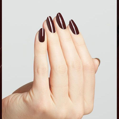 hands wearing MI12 Complimentary Wine Nail Lacquer by OPI