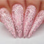 Hands wearing 496 Pinking Of Sparkle Gel Polish by Kiara Sky