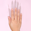 Hands Wearing Stiletto C-Curve Tips XXL Clear By DND DC
