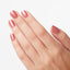 hands wearing M27 Cozu-Melted In Sun Nail Lacquer by OPI