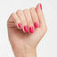 hands wearing E44 Pink Flamenco Gel Polish by OPI