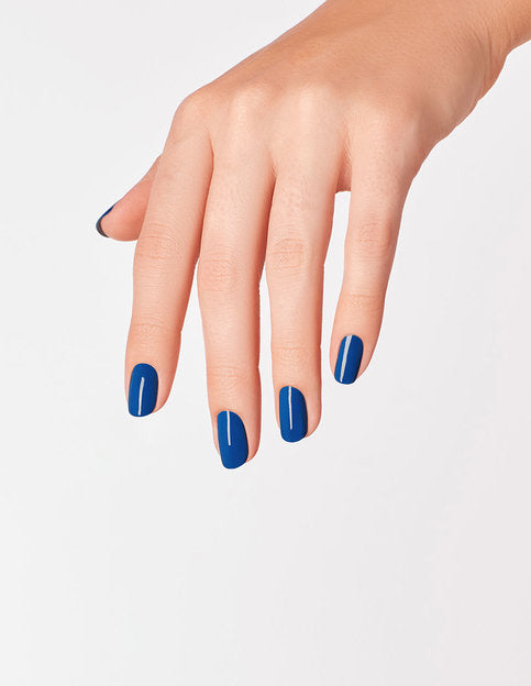 hands wearing M92 Mi Casa Es Blue Casa Gel Polish by OPI