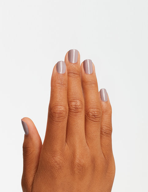 hands wearing A61 Taupe-Less Beach Nail Lacquer by OPI